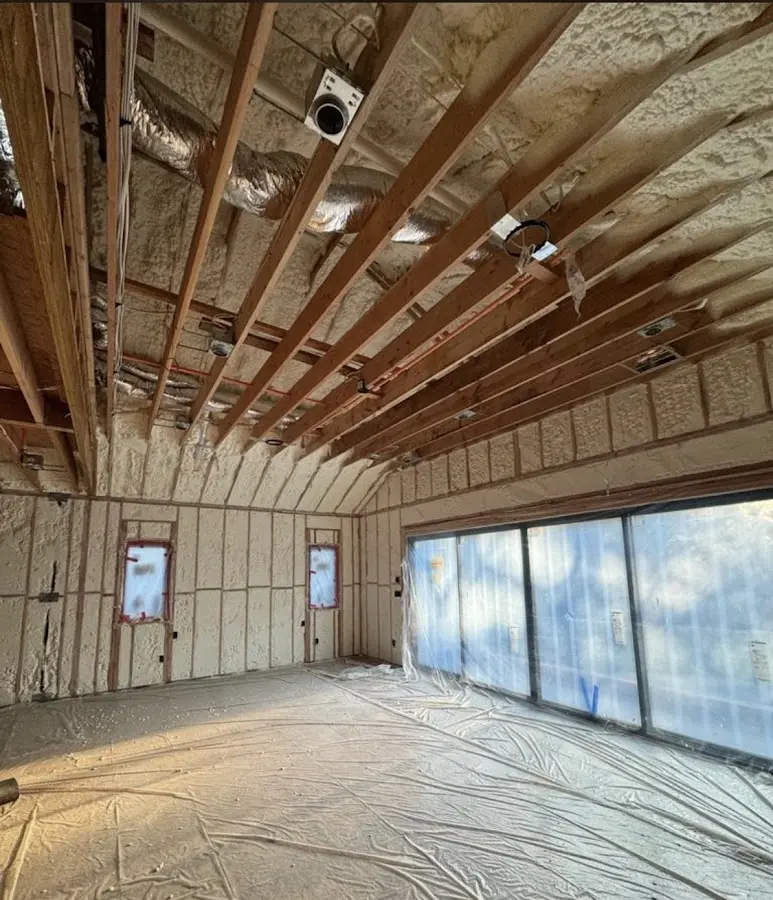 Interior walls and ceiling insulated with spray foam during new construction in Frankford